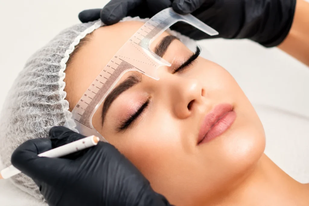 Brow position being measured during a facial assessment